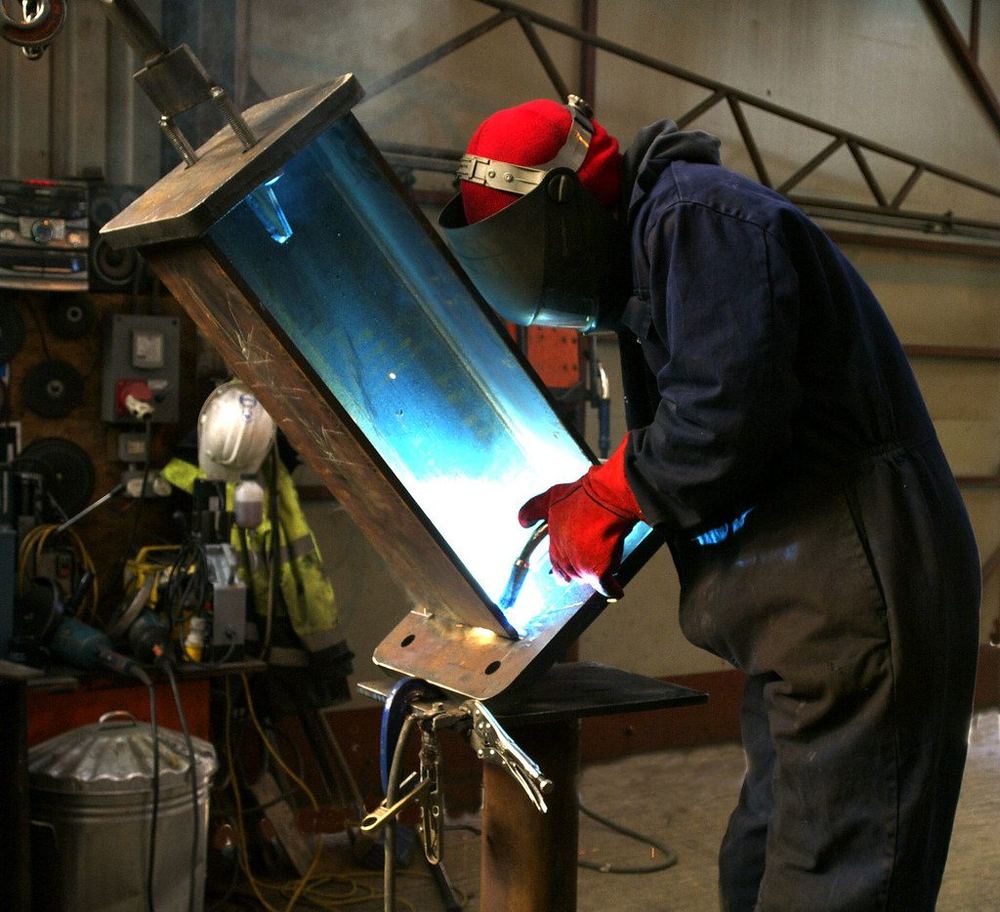 MIG welding a steel beam